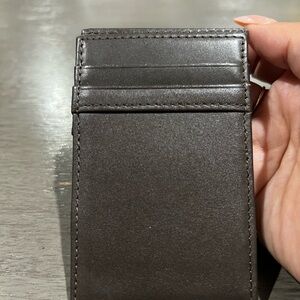 Dark brown leather wallet.  4"H x 2 5/8"W
J. CREW